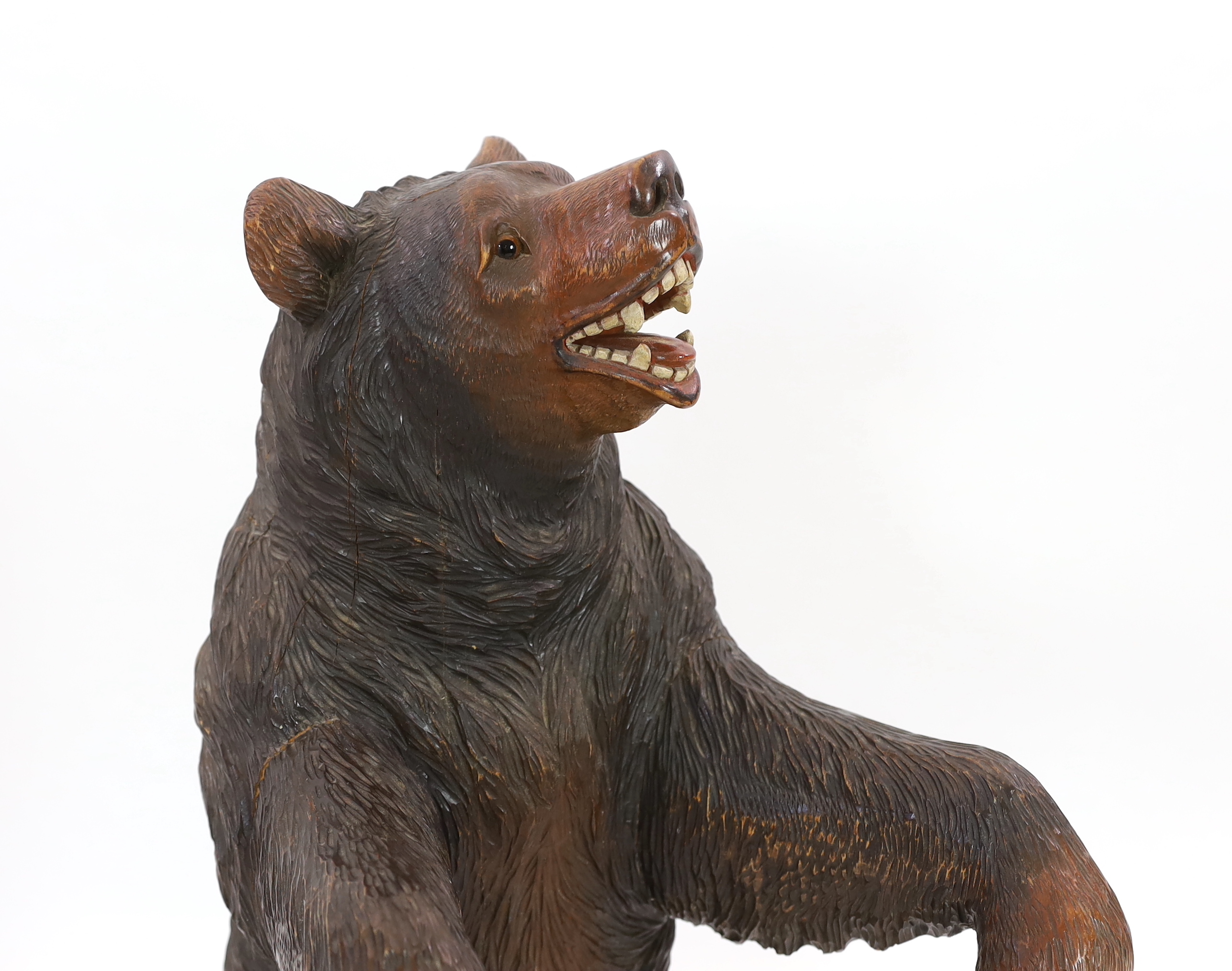 A late 19th century Black Forest carved wood bear stick stand